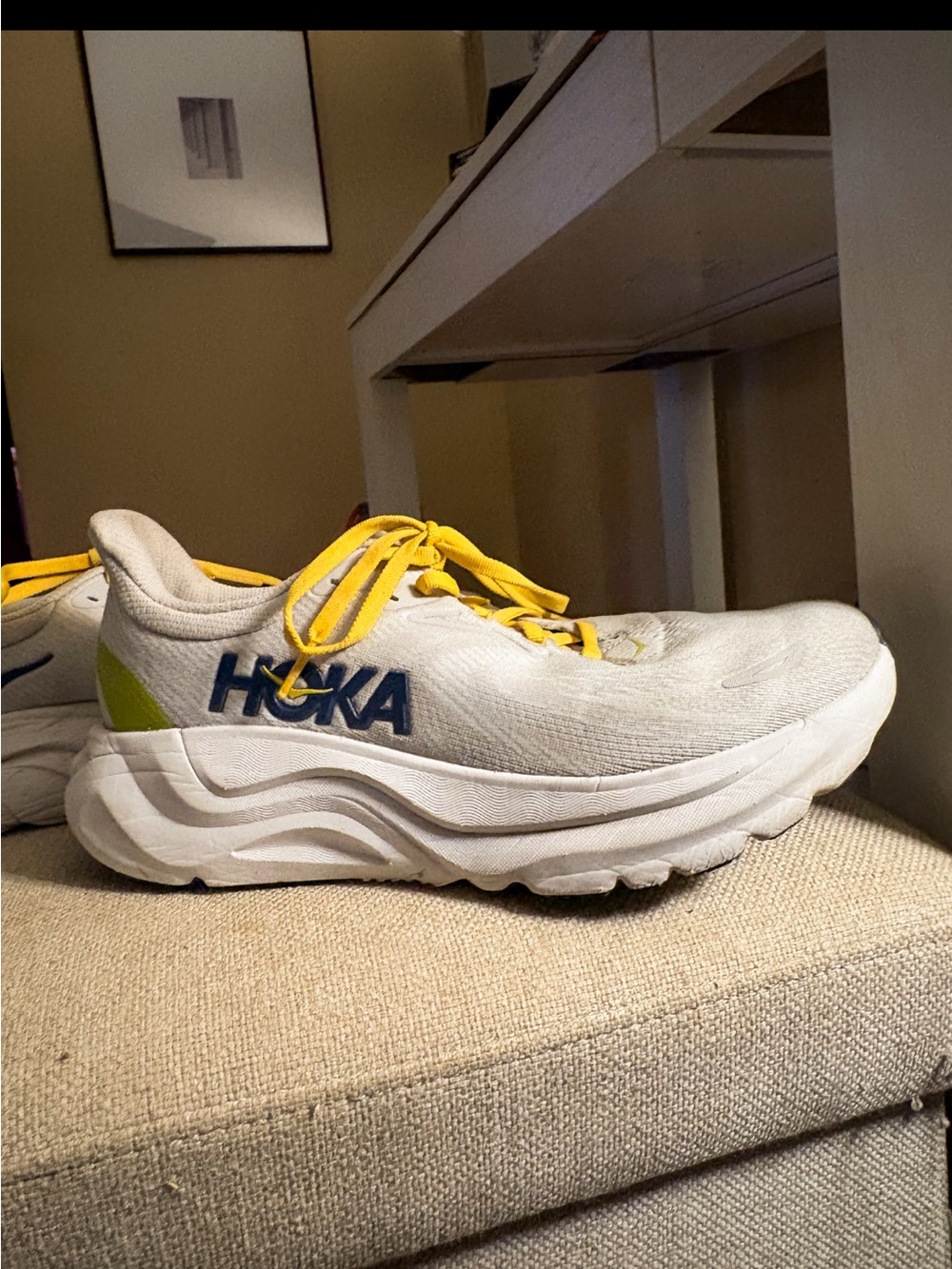 Hoka Men's White Running Shoe with Yellow Laces and Blue Logo